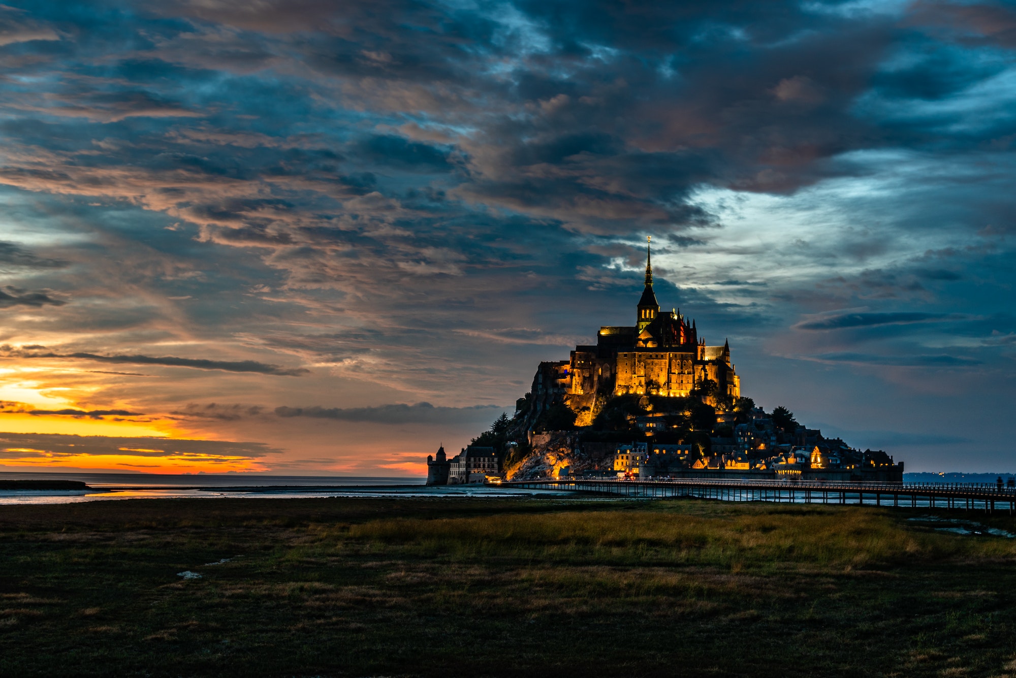 Dramatic sunset on Mont Saint Michel, Normandy